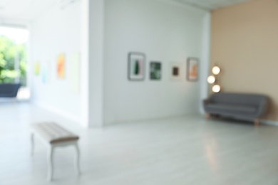 Photo of Blurred view of modern art gallery with exhibits