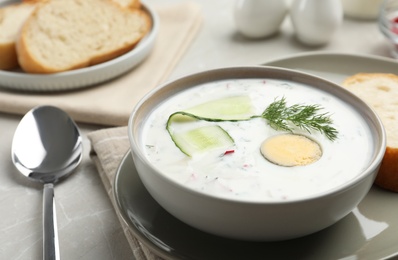 Photo of Delicious cold summer soup on light table, closeup