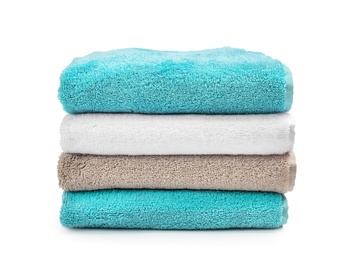 Photo of Stack of clean soft towels on white background