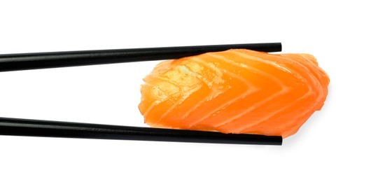 Chopsticks with delicious nigiri sushi isolated on white, top view