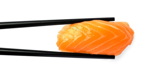 Photo of Chopsticks with delicious nigiri sushi isolated on white, top view