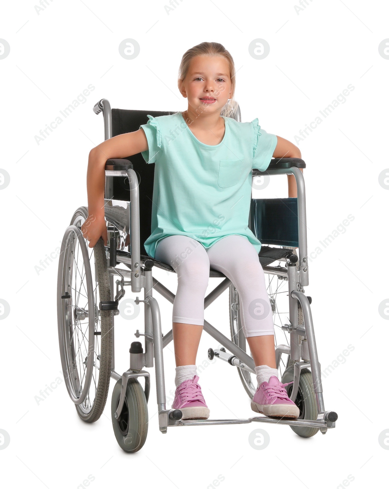 Photo of Little girl in wheelchair on white background