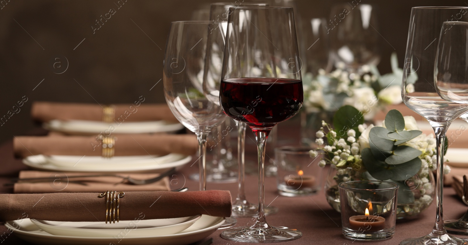 Image of Glass of delicious wine and elegant table setting in restaurant. Banner design