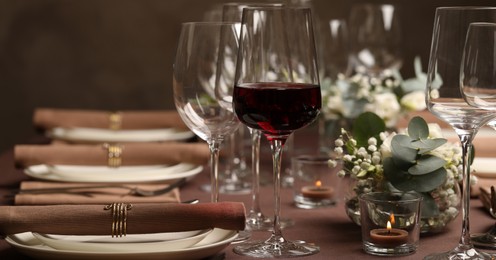 Image of Glass of delicious wine and elegant table setting in restaurant. Banner design