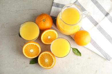 Flat lay composition with orange juice and fresh fruit on light background