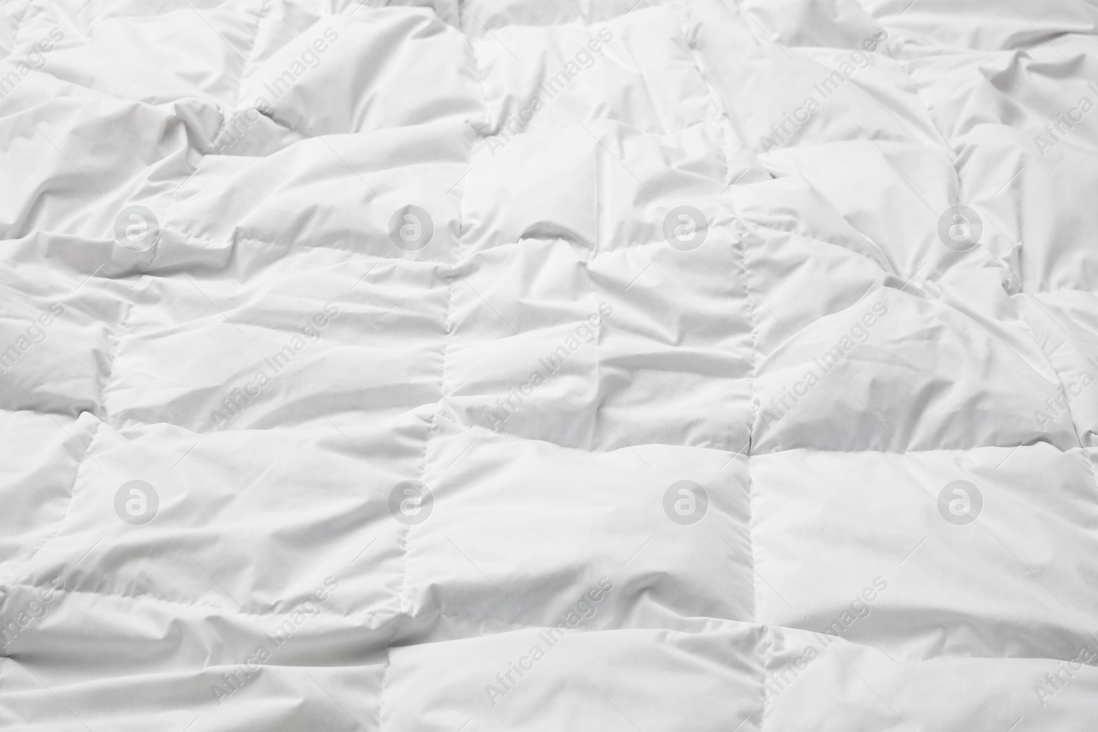 Photo of Soft crumpled blanket as background, closeup view