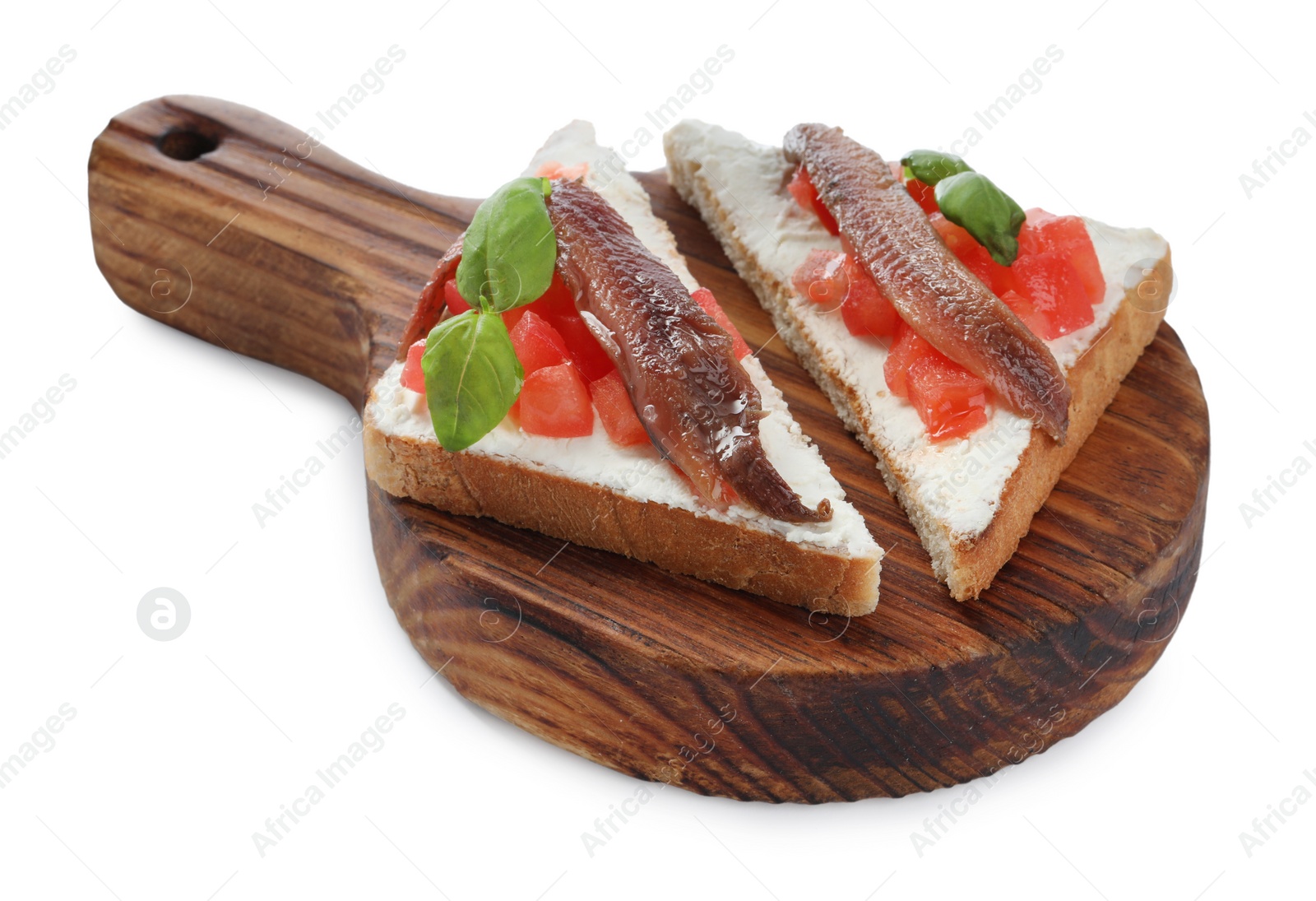 Photo of Delicious sandwiches with cream cheese, anchovies, tomatoes and basil on white background