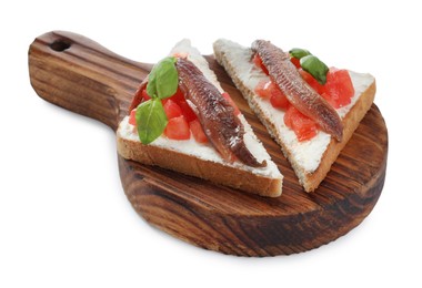 Photo of Delicious sandwiches with cream cheese, anchovies, tomatoes and basil on white background