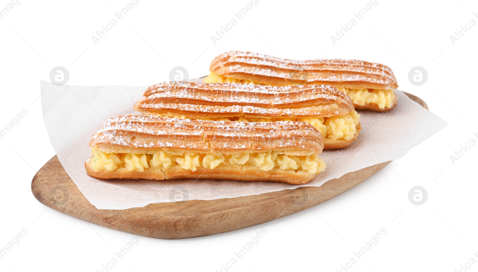 Photo of Delicious eclairs filled with cream isolated on white