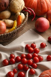 Photo of Different fresh ripe vegetables, berries and fruits on wooden table. Farmer produce