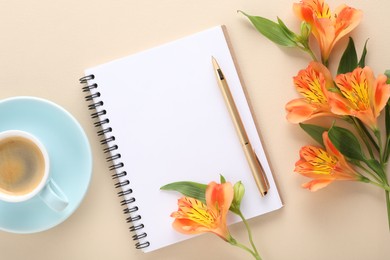 Guest list. Notebook, pen, coffee and beautiful flowers on beige table, flat lay. Space for text