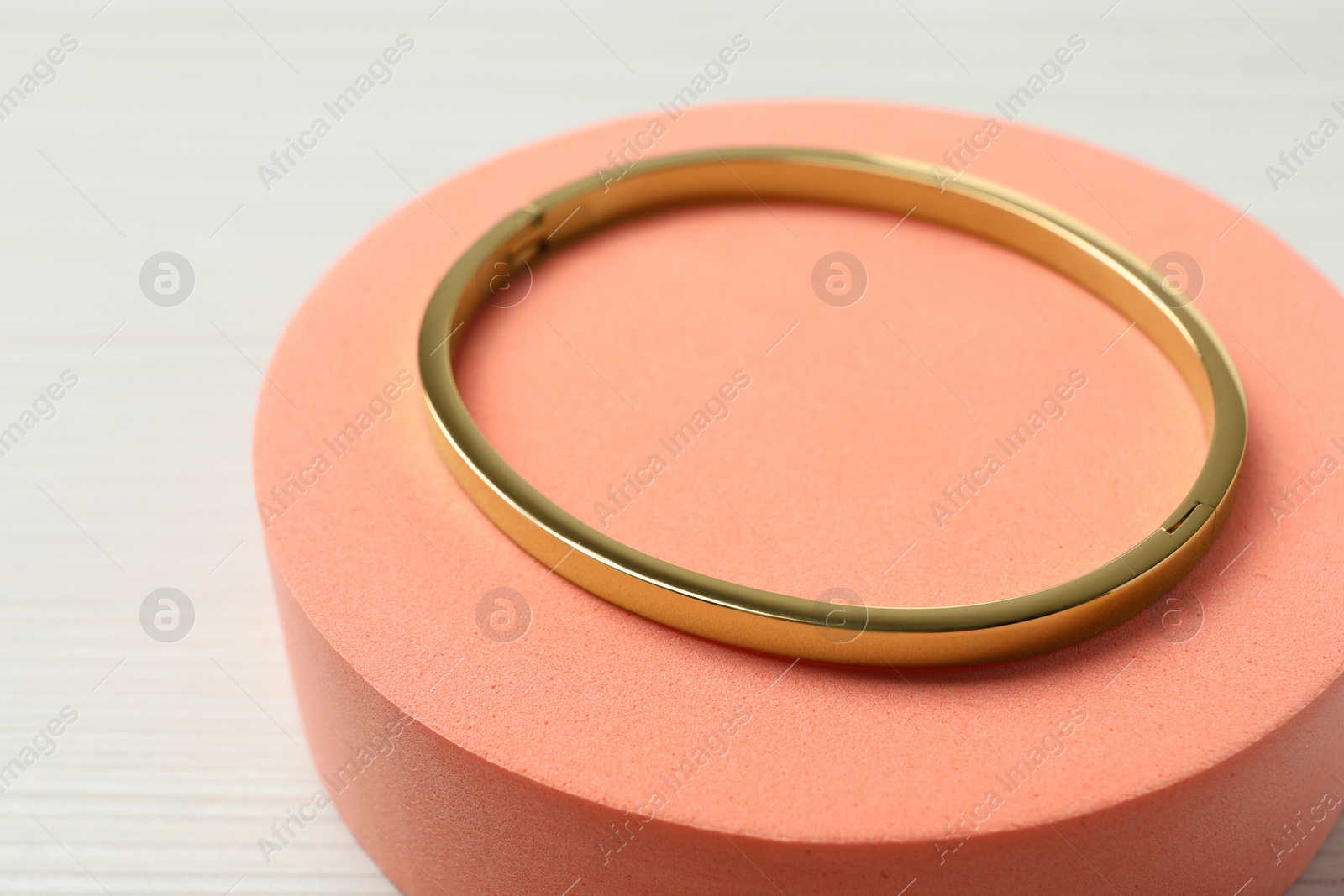 Photo of Stylish presentation of bracelet on podium, closeup. Space for text