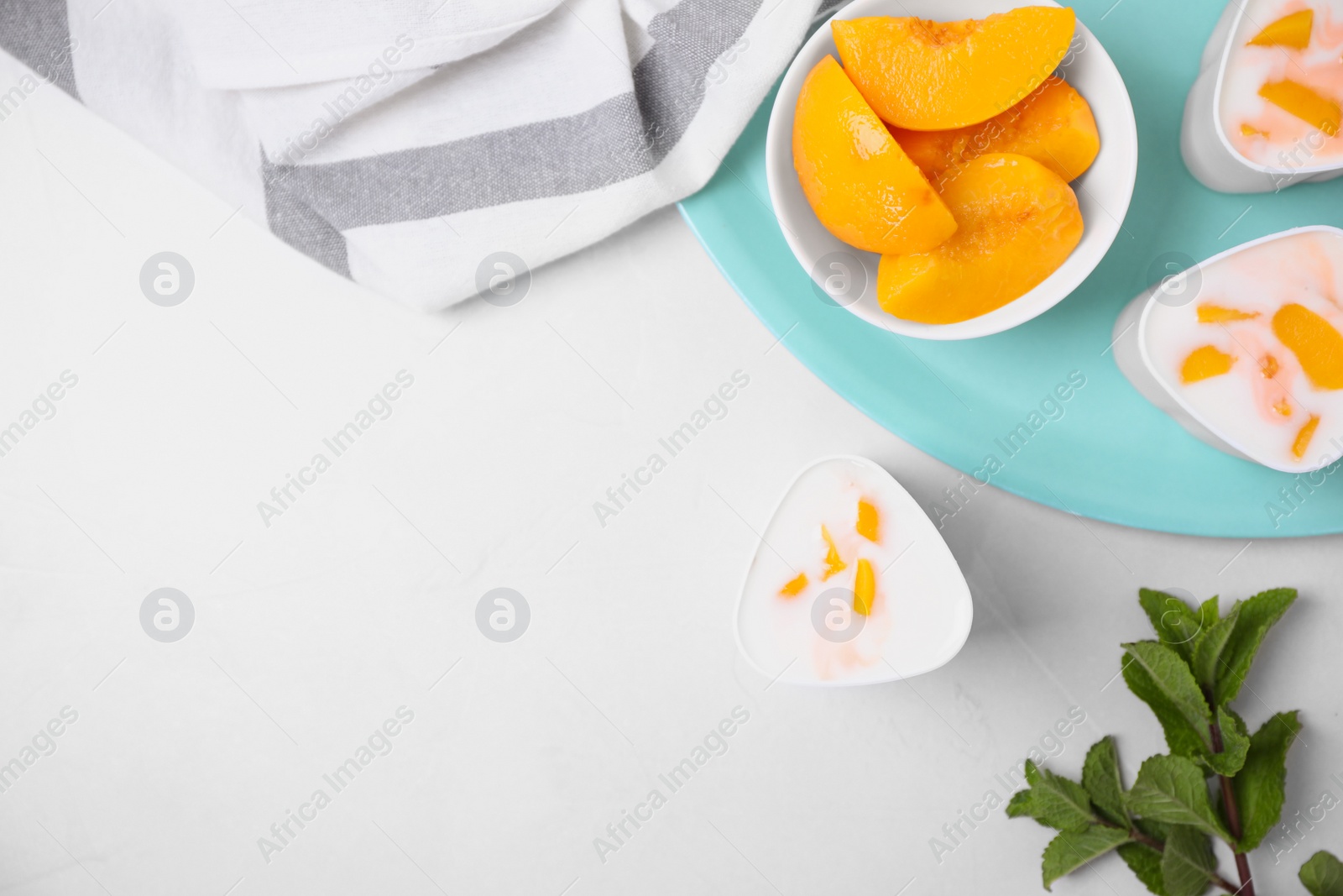 Photo of Flat lay composition with yogurt and ingredients on light background, space for text. Multi cooker recipe