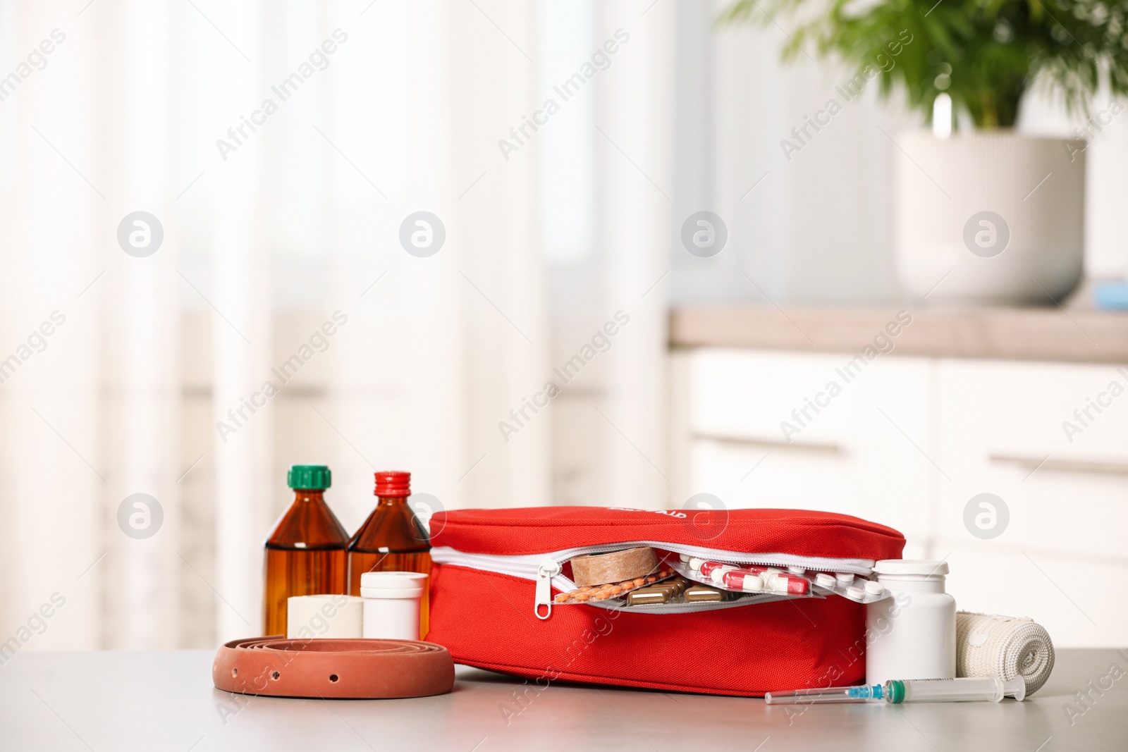 Photo of First aid kit on table indoors, space for text