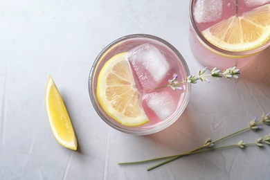 Photo of Flat lay composition with natural lemonade on light background