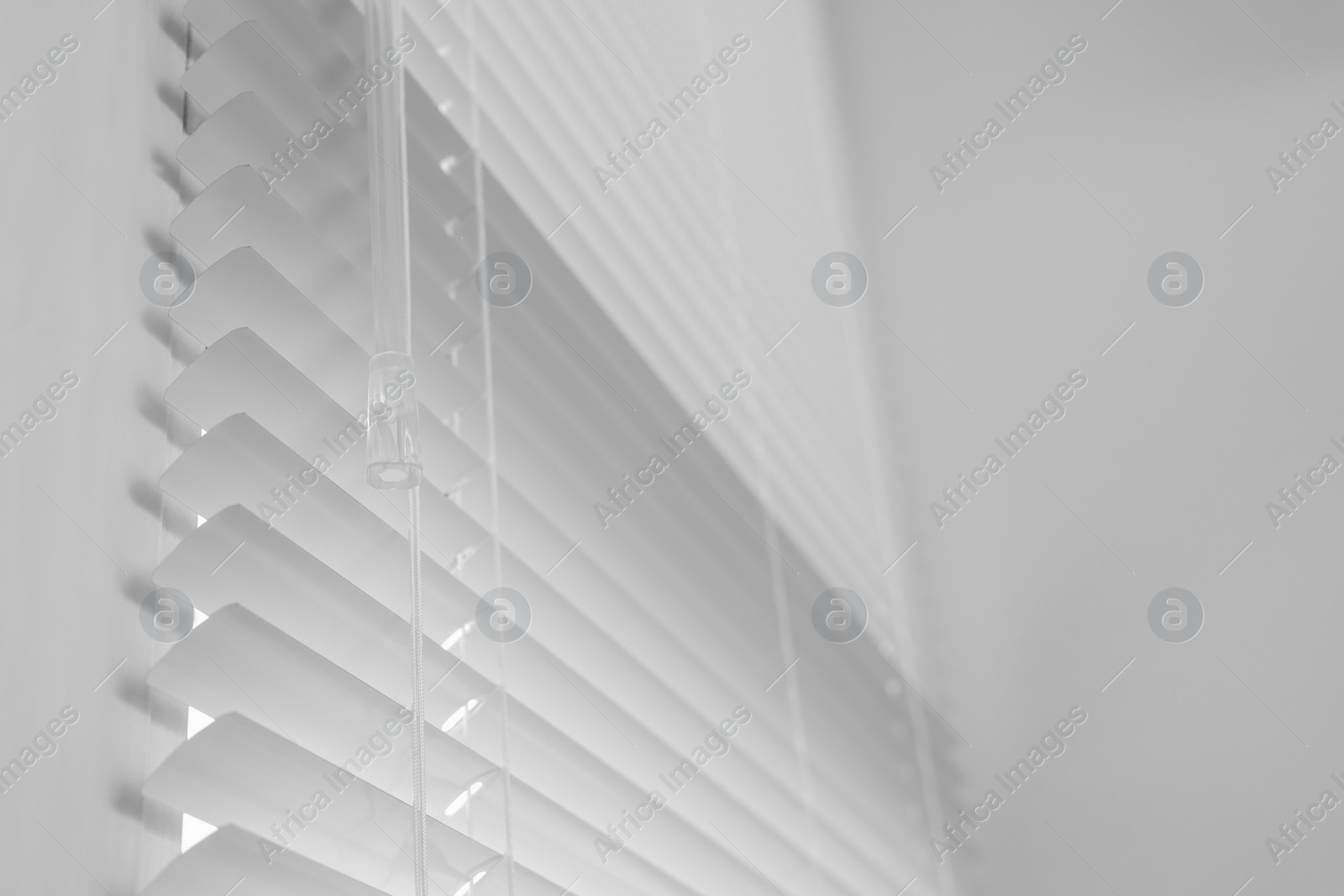 Photo of Closeup view of stylish horizontal window blinds