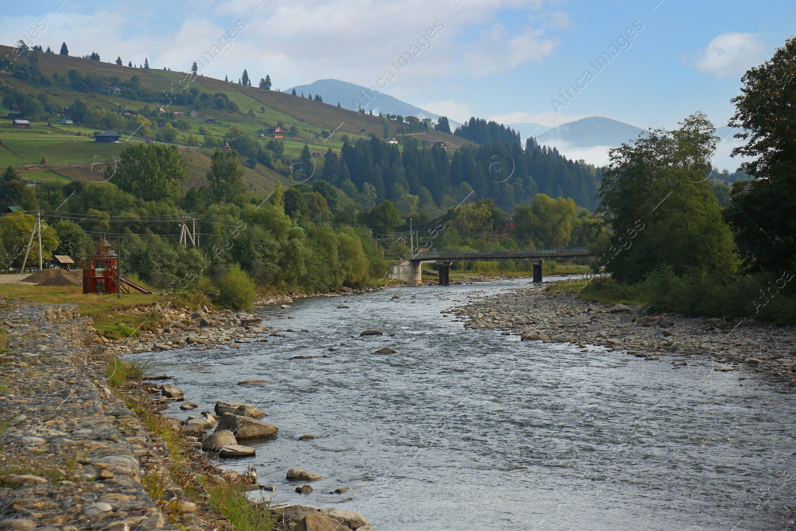 Photo of Picturesque view of beautiful river flowing near mountain