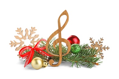 Wooden music note with fir tree branches and Christmas decor on white background