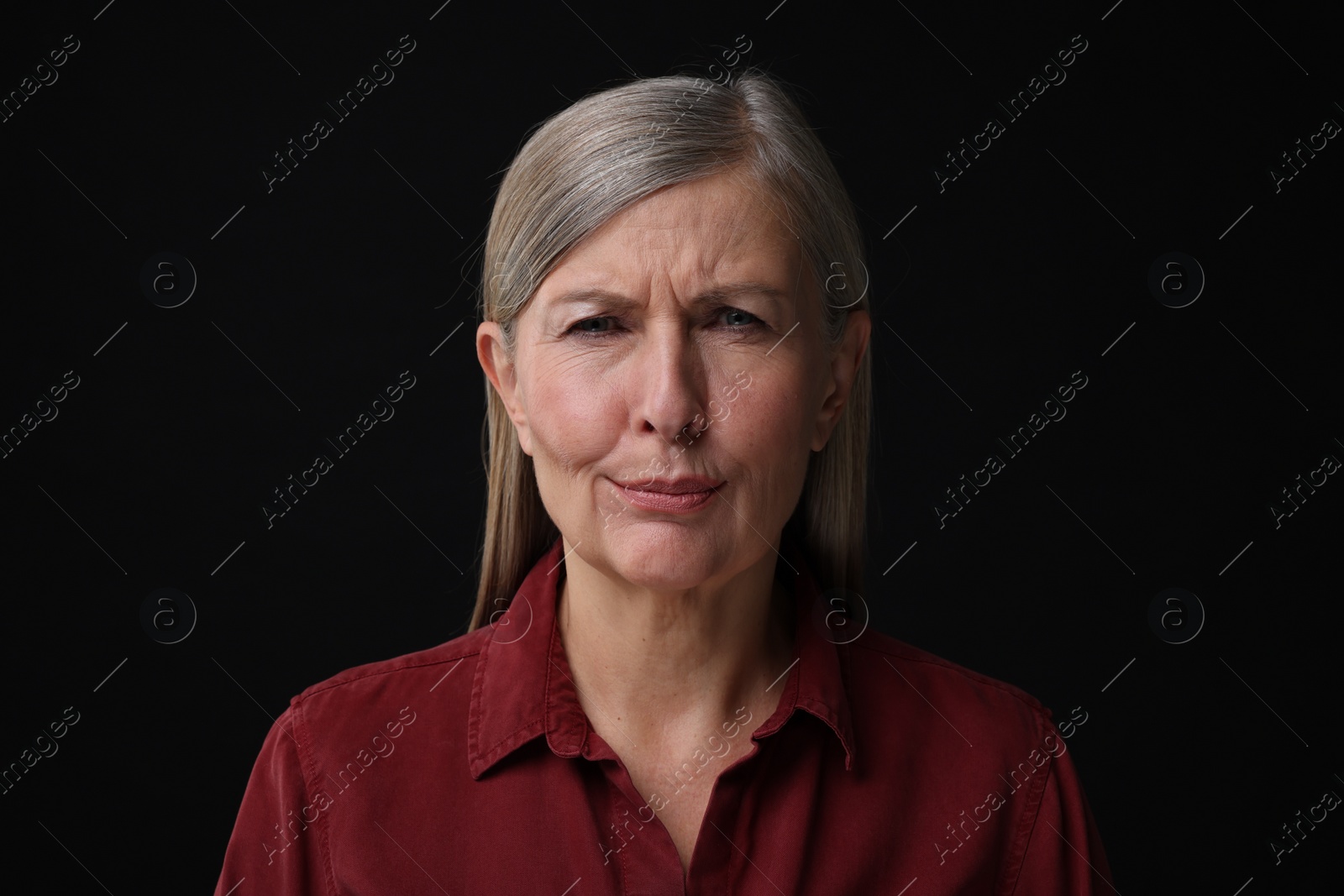 Photo of Personality concept. Portrait of emotional woman on black background