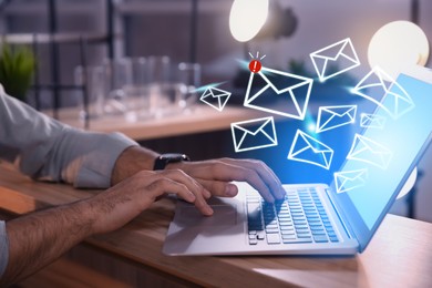 Image of Businessman sending emails at table indoors, closeup