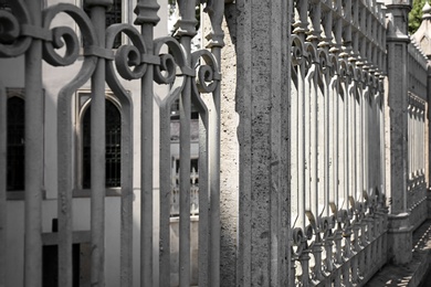 Photo of Beautiful view of ornate grey fence, closeup