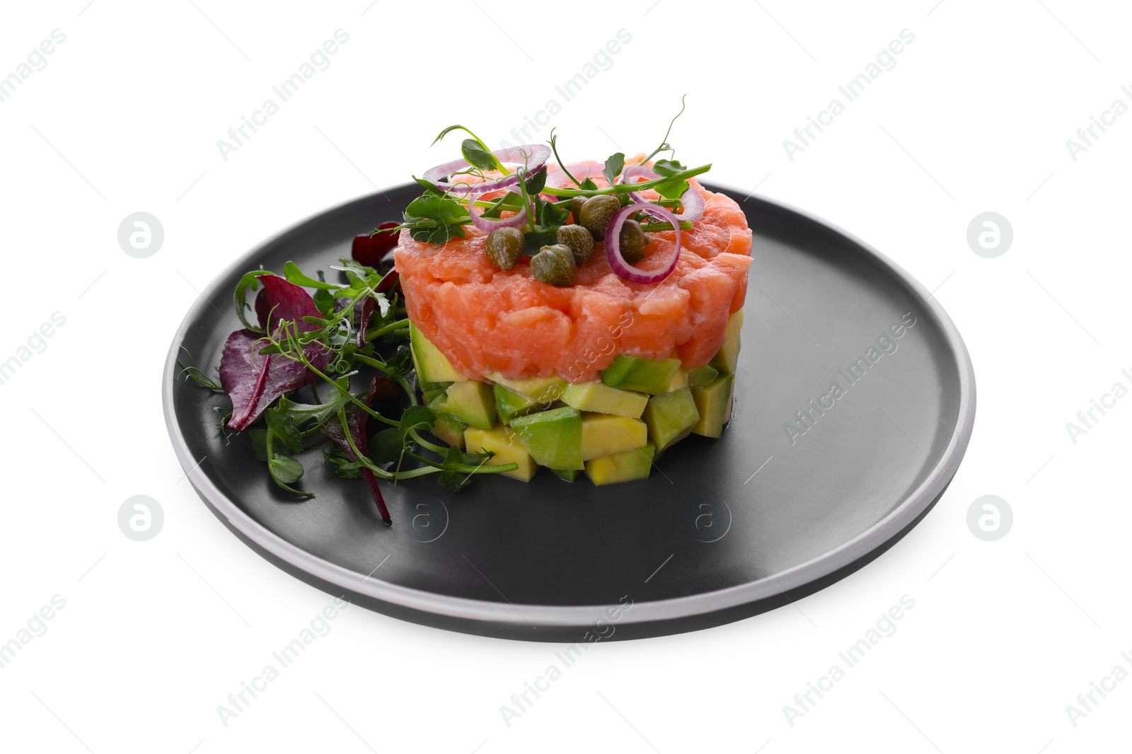 Photo of Tasty salmon tartare with avocado and greens isolated on white