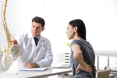 Photo of Young woman visiting orthopedist in medical office