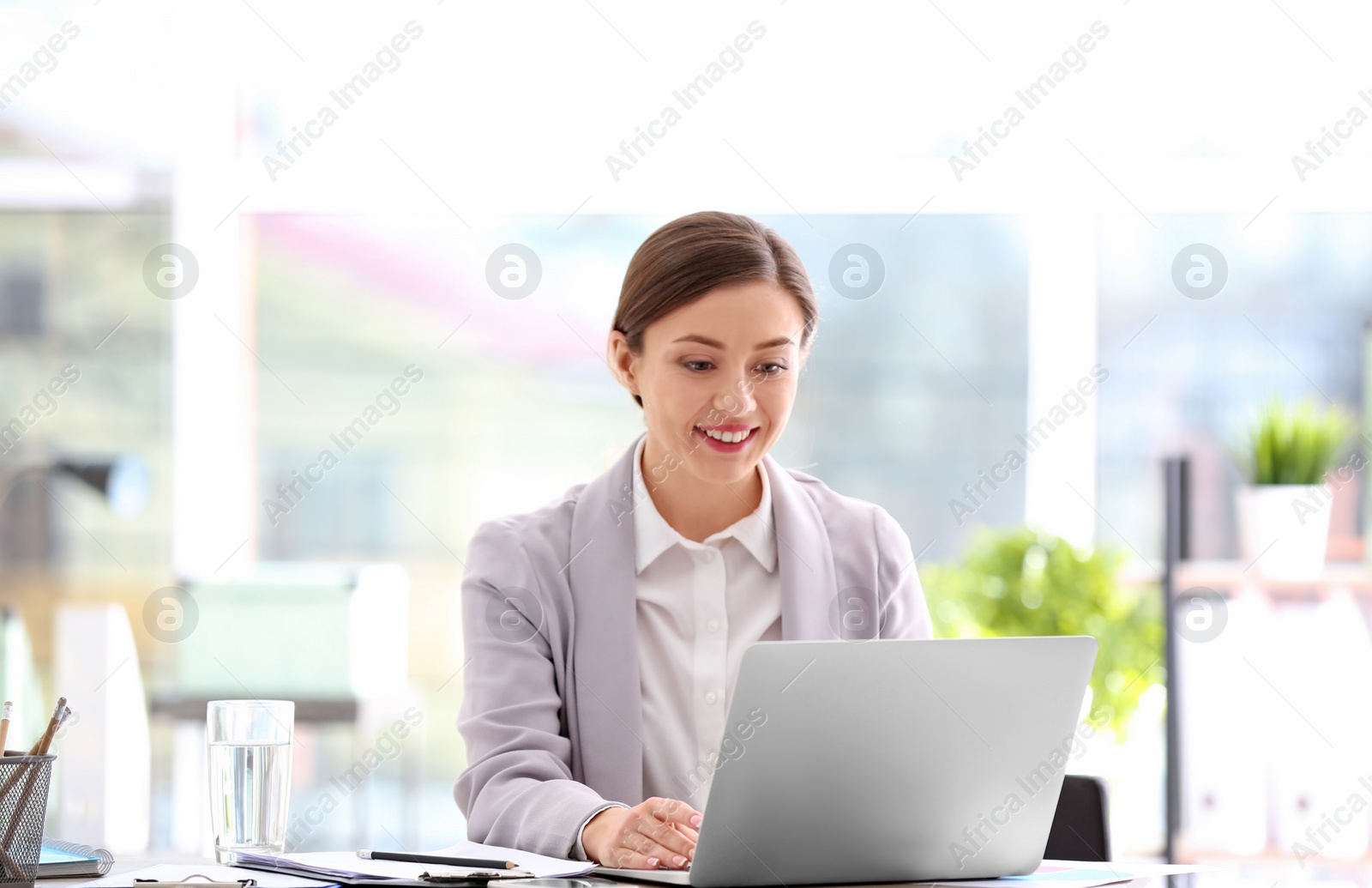 Photo of Consultant working at table in office