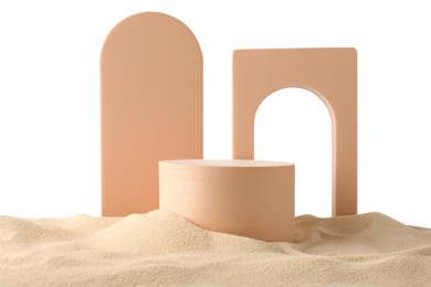 Photo of Presentation of product. Different podiums on sand against white background