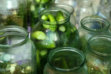 Photo of Glass jar with fresh cucumbers, closeup. Pickling vegetables