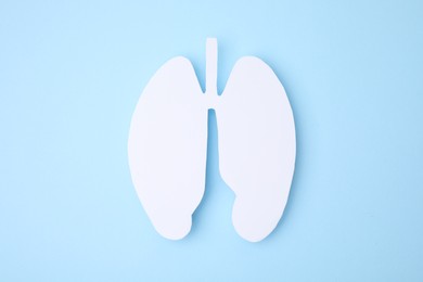 Photo of No smoking concept. Paper lungs on light blue background, top view