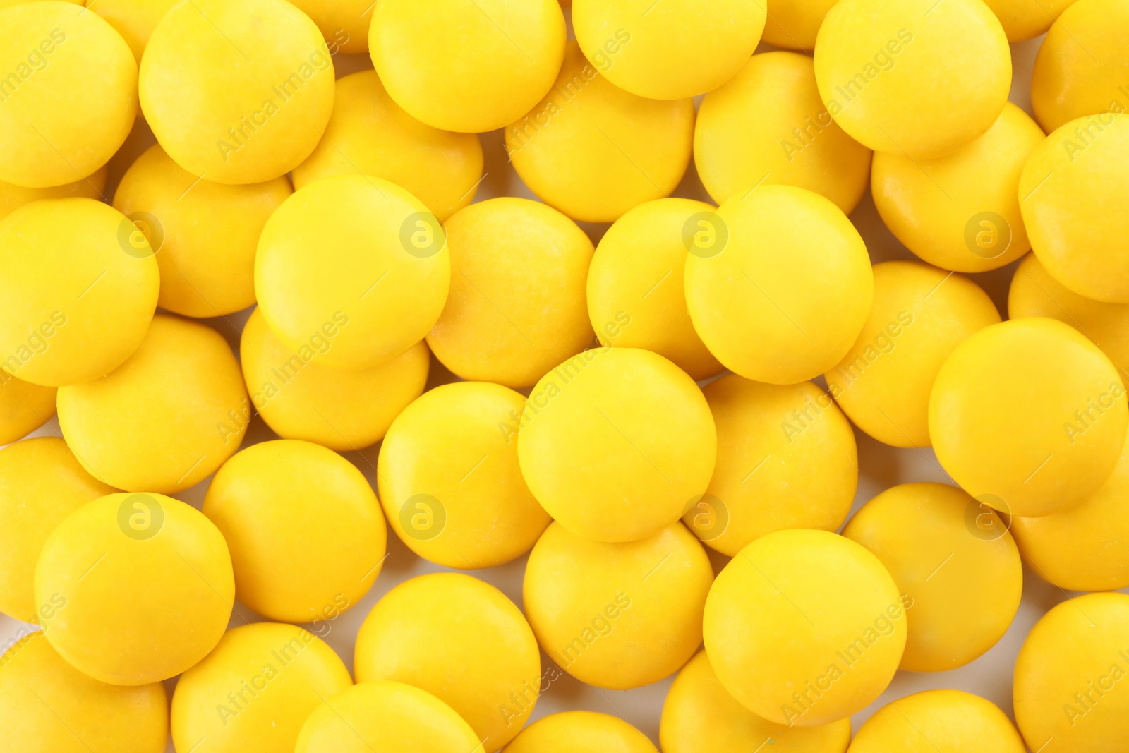 Photo of Many colorful candies as background, top view