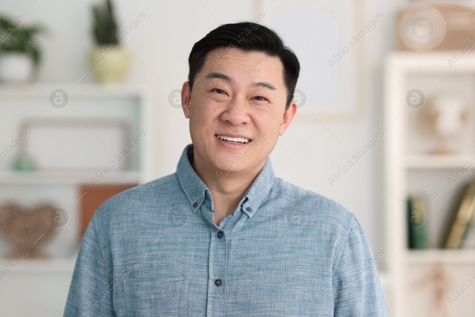 Photo of Portrait of smiling friendly businessman in office