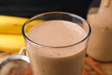 Glass of tasty banana smoothie, closeup view