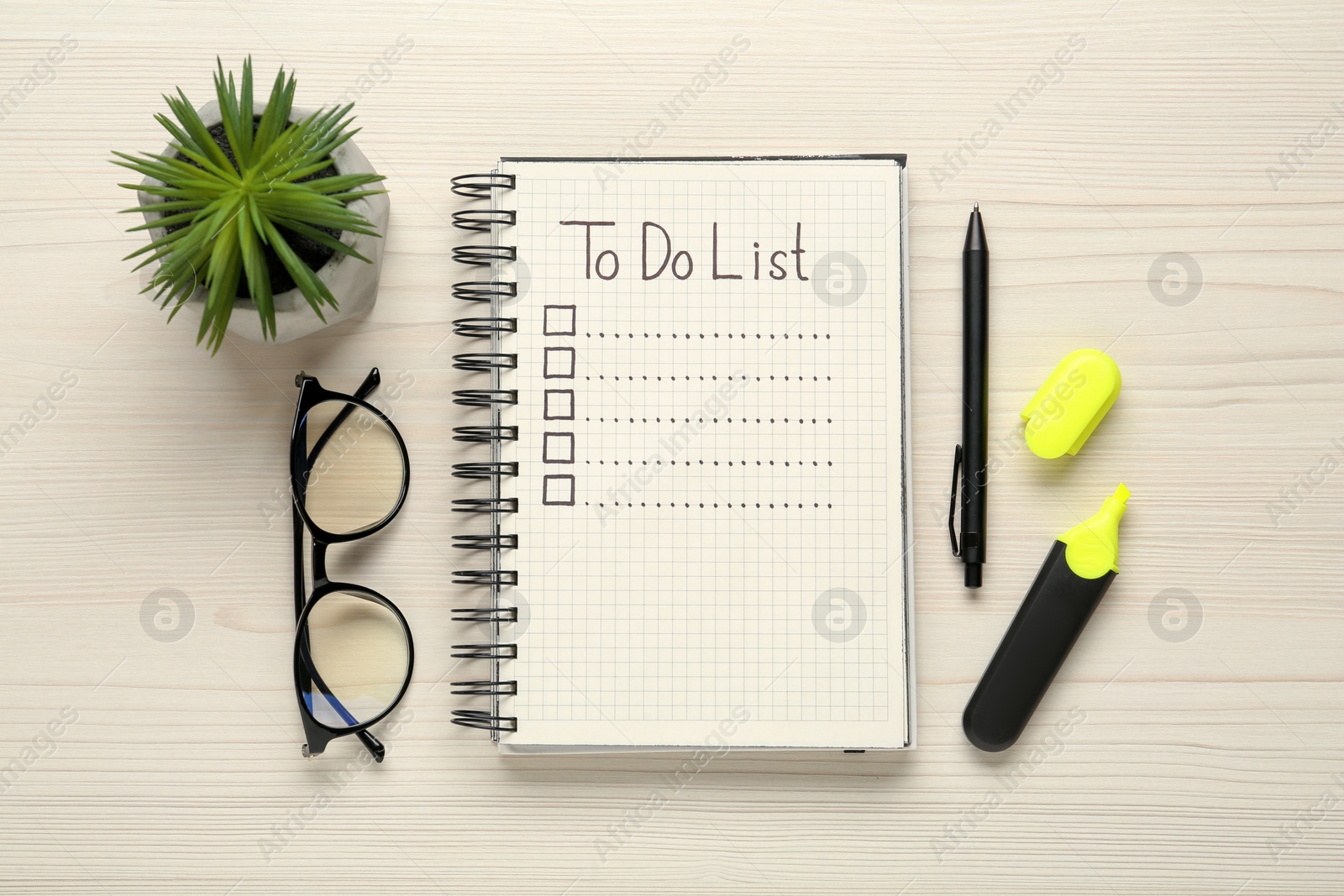 Photo of Flat lay composition with unfilled To Do list in notepad and houseplant on wooden table