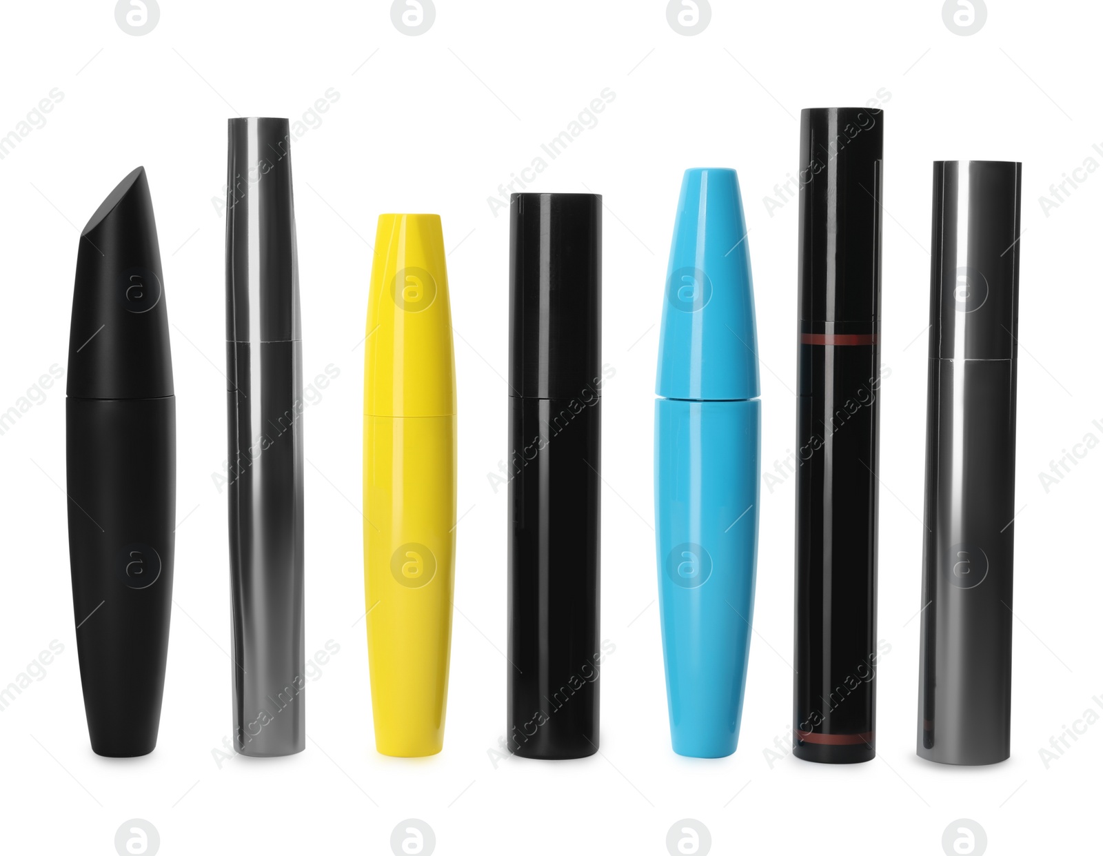 Photo of Many mascaras for eyelashes on white background. Makeup product