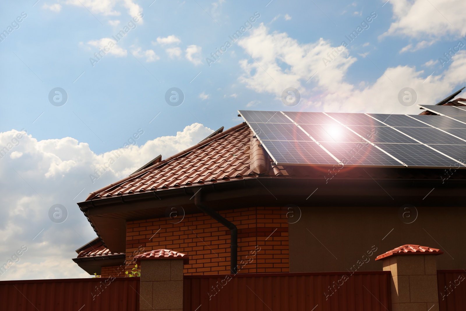 Photo of Building with installed solar panels on roof. Alternative energy source