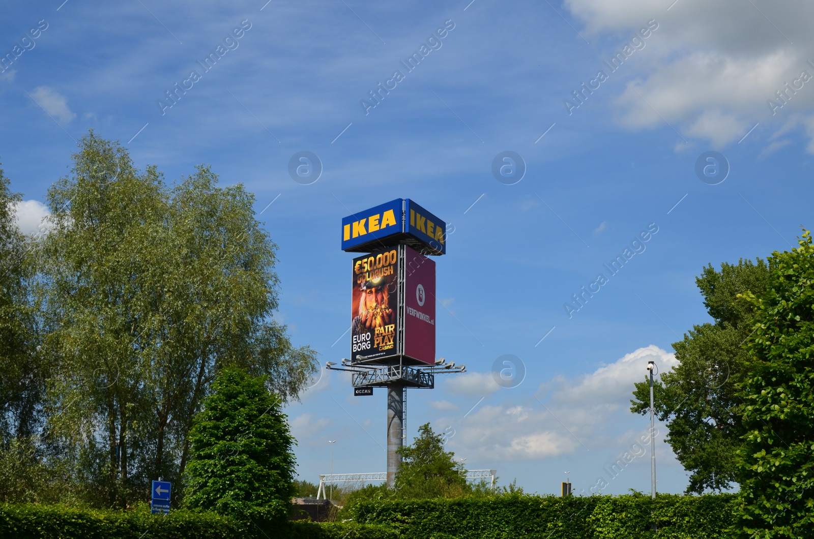 Photo of GRONINGEN, NETHERLANDS - MAY 17, 2022: Stand with advertising posters and IKEA sign in park