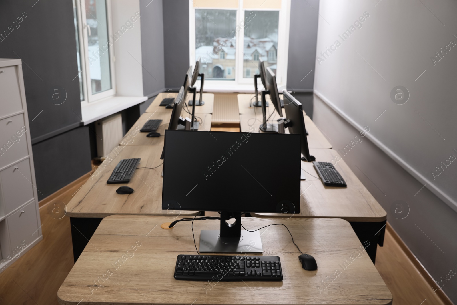 Photo of Many modern computers in open space office