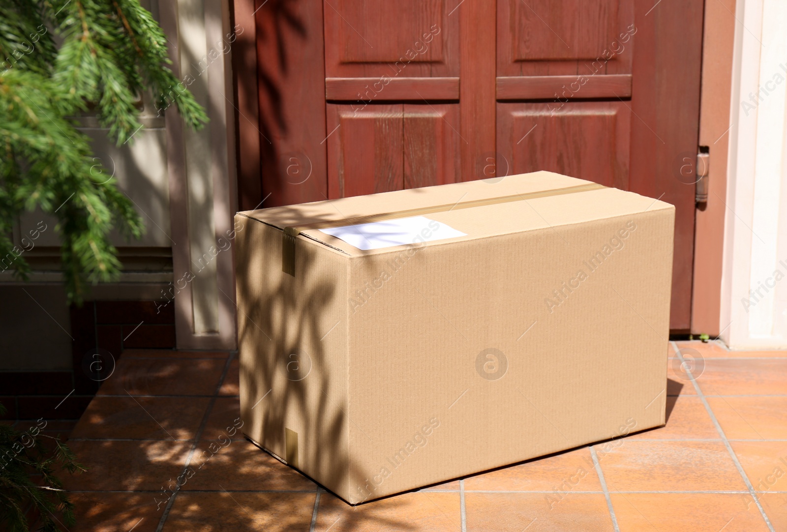 Photo of Delivered parcel on porch near front door