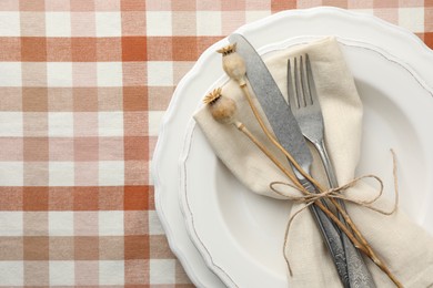 Photo of Stylish setting with cutlery and plates on table, top view. Space for text