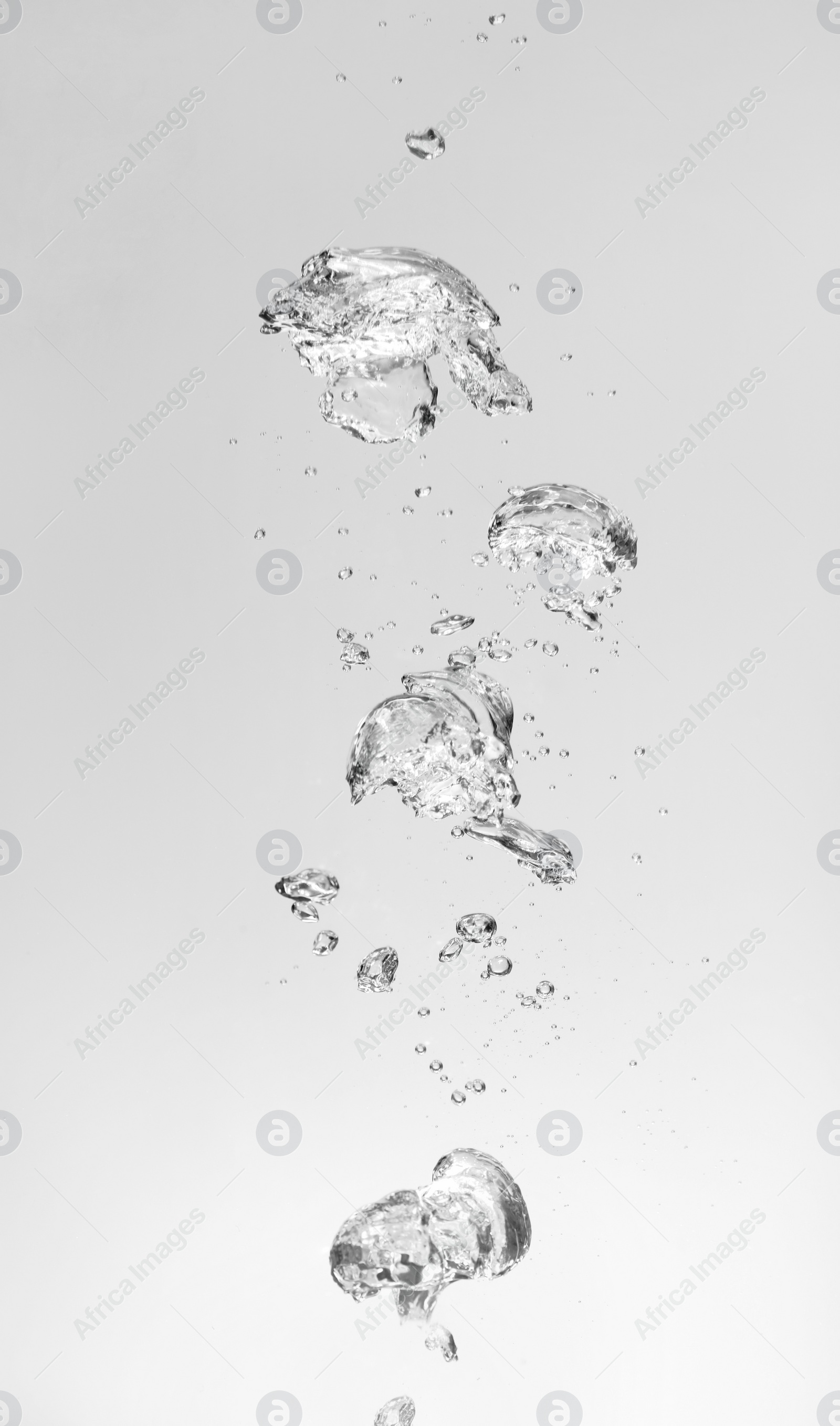 Photo of Air bubbles in water on white background