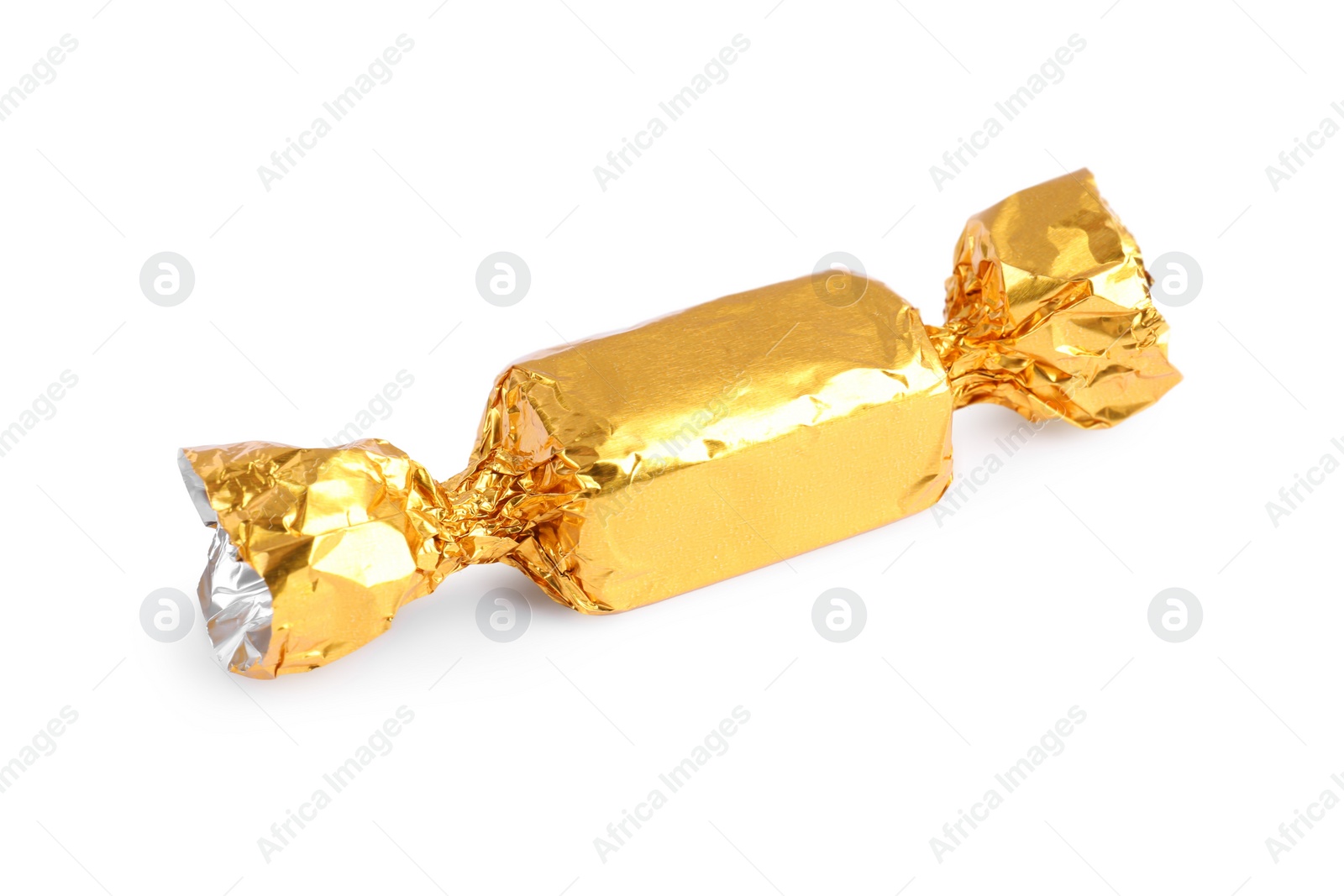 Photo of Tasty candy in golden wrapper isolated on white