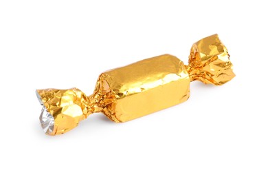 Photo of Tasty candy in golden wrapper isolated on white