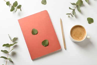 Photo of Flat lay composition with book, cup of coffee and leaves on white background