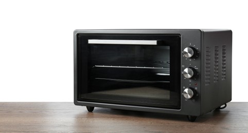 One electric oven on wooden table against white background