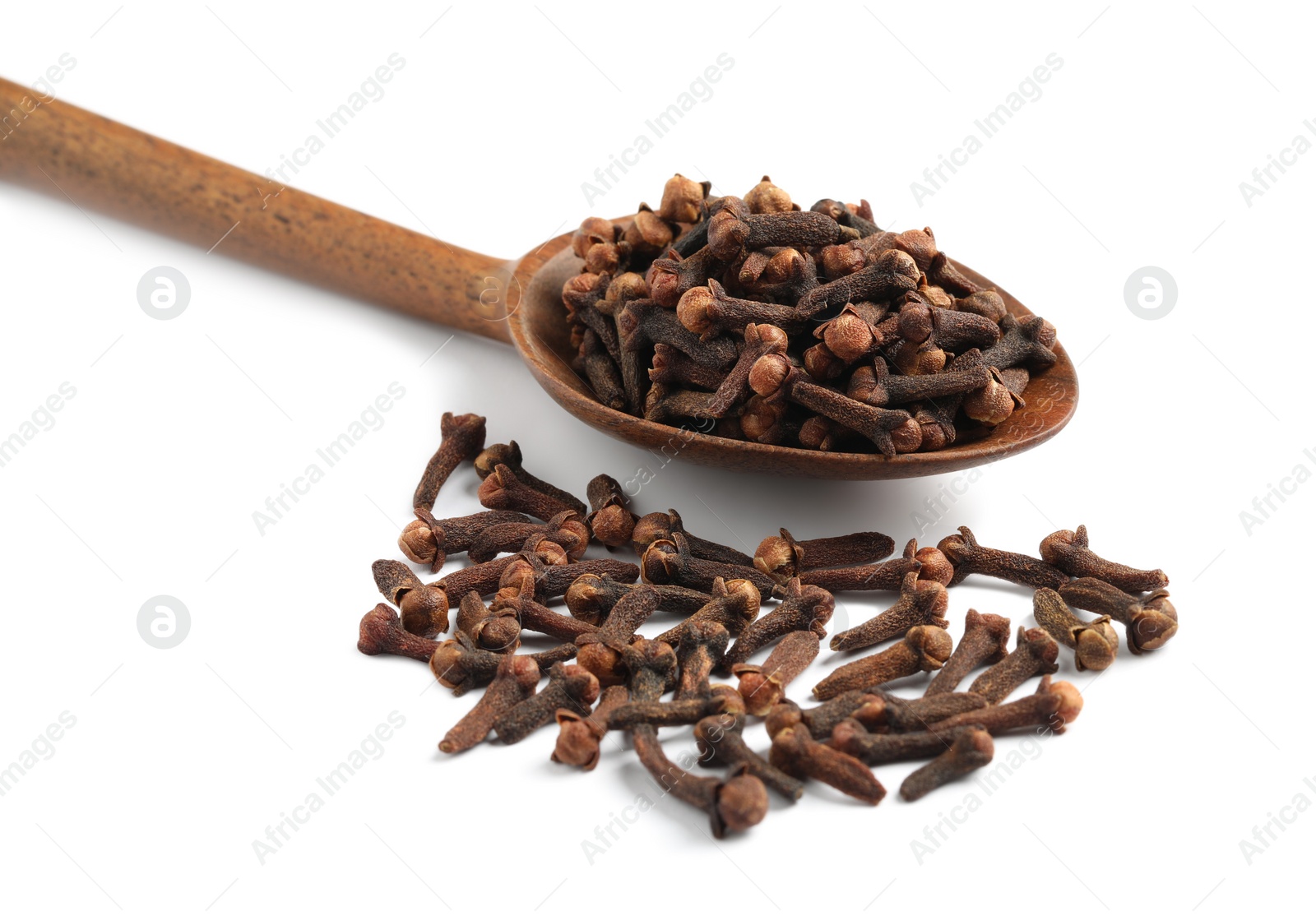 Photo of Aromatic dry cloves and wooden spoon on white background, closeup