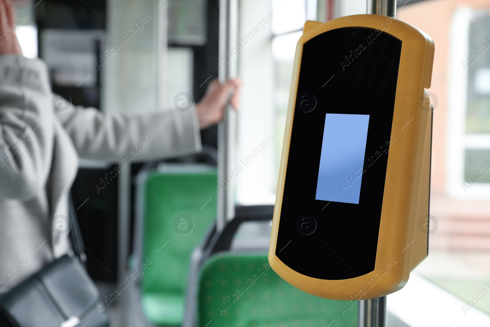 Photo of Contactless fare payment device in public transport, space for text