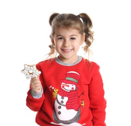 Cute little girl with Christmas gingerbread cookie on white background