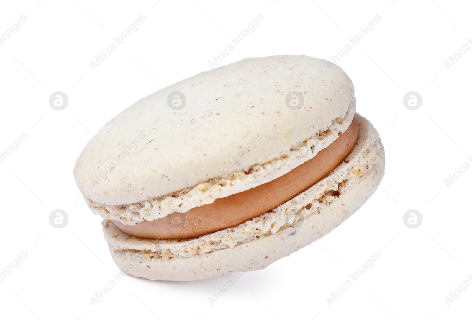 Photo of Beige macaron isolated on white. Delicious dessert